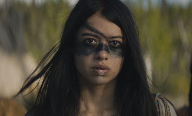 Screenshot from 'Prey'. A Comanche woman gazes into the camera.