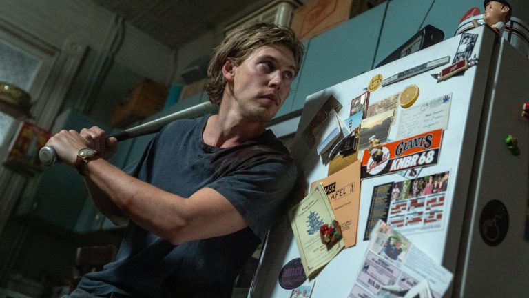 Austin Butler wielding a baseball bat in Caught Stealing