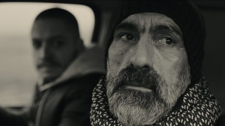 Tudor Cucu-Dumitrescu and Erdal Yildiz sat in a van in The Ceremony.