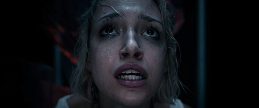A woman crying with makeup smudged on her face in a scene from Dead By Dawn.
