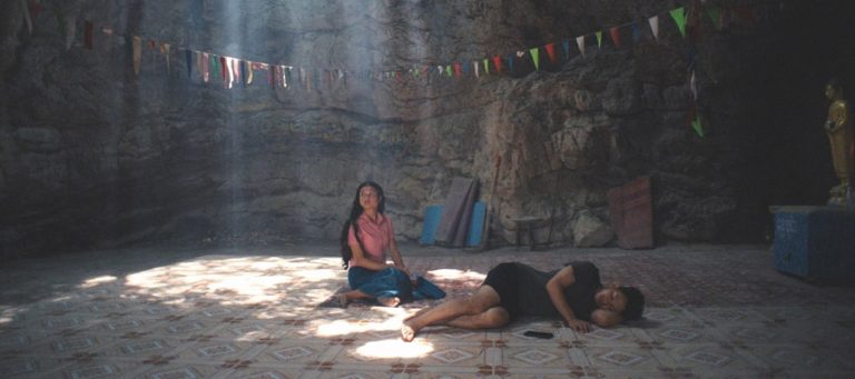 Thida waits patiently for Hai to wake in a cave in Becoming Human.