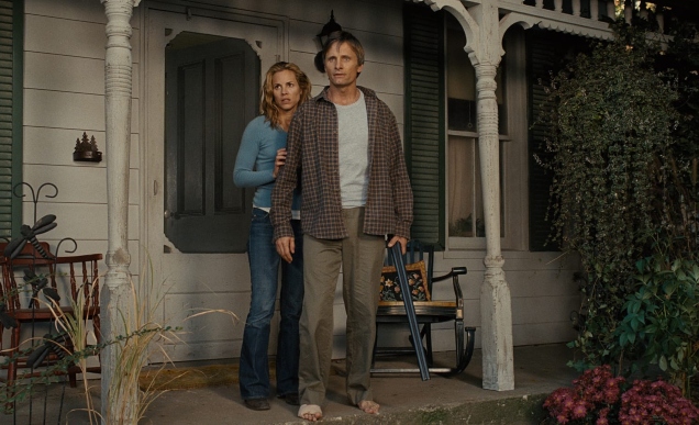 A scene from David Cronenburg's A History of Violence showing Viggo Mortensen and Maria Bello standing in a porch.