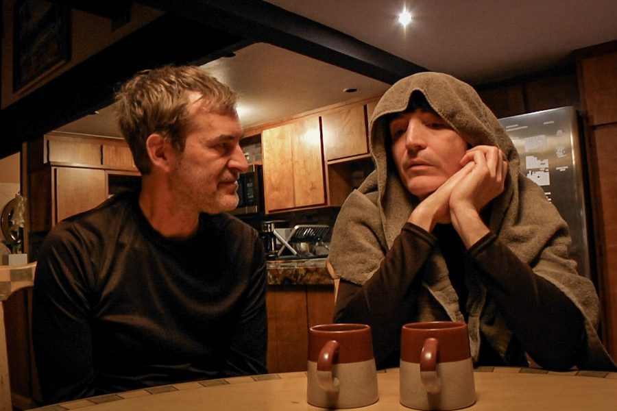 Mark Duplass and David Dastmalchian sat together at a table in a scene from The Creep Tapes season two.