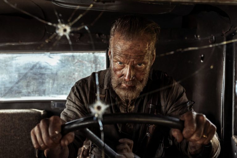 Jorma Tommila in Sisu: Road to Revenge, driving a bullet-riddled truck.